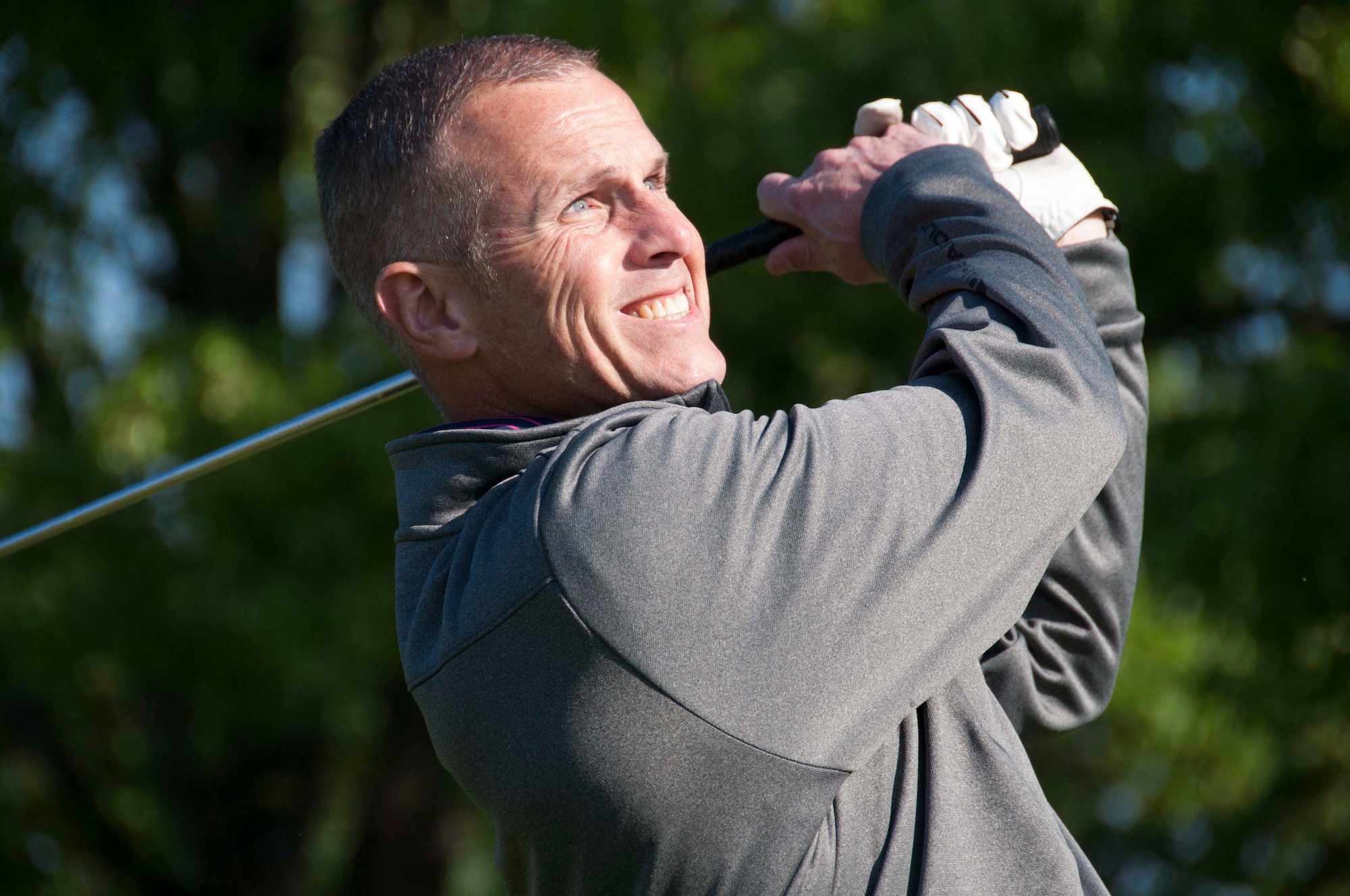 Flavius Alligood watches the path of his golf ball during a golf tournament on Barksdale Air Force Base, La. on April 2, 2016. The golf tournament is part of the annual 307th Bomb Wing Family Day. (U.S. Air Force photo by Tech. Sgt. Ted Daigle/Released)