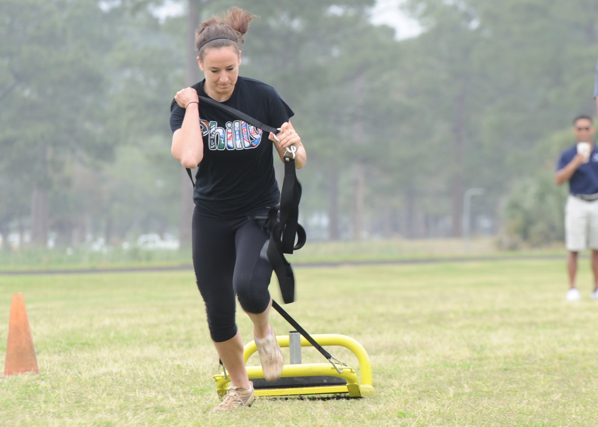 Second Lt. Ashley Feldman, 325th Contracting Squadron contracting specialist, tows a weight sled April 1 during the strongman competition on Comprehensive Airman Fitness day. (U.S. Air Force photo by Senior Airman Ty-Rico Lea/Released)