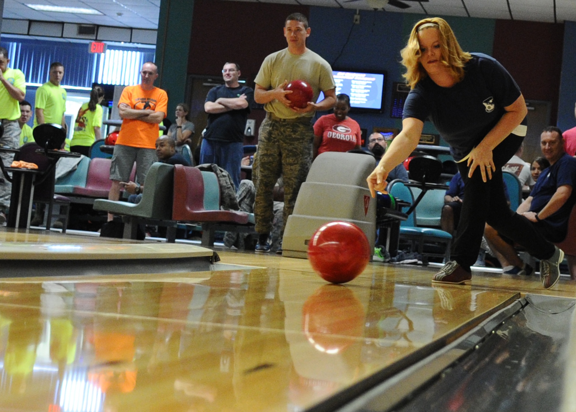 Technical Sgt. Leslie Millard, Airey NCO academy instructor, bowls at Raptor Lanes during Comprehensive Airman Fitness Day. (U.S. Air Force photo by Senior Airman Ty-Rico Lea/Released)