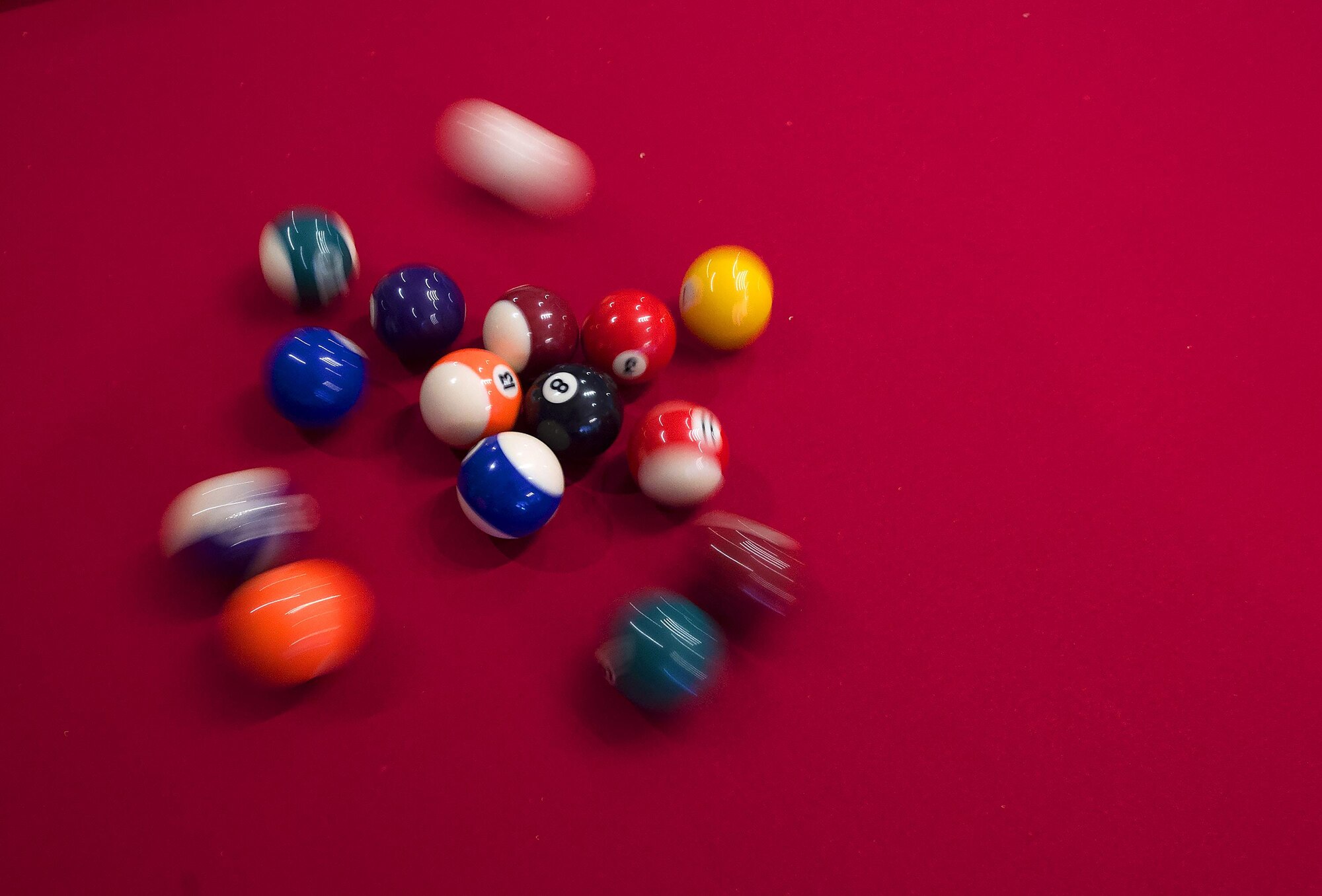 Pool balls scatter on the break during a game of pool in the Trail’s End Event Center on F.E. Warren Air Force Base, Wyo., April 1, 2016. The recently-reopened event center is hosting a pool tournament Saturday, April 9. (U.S. Air Force photo by R.J. Oriez)