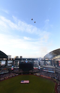 A two-ship formation of F-35A Lightning II Joint Strike Fighters from the 62nd Fighter Squadron flies over Chase Field ballpark in Phoenix, Ariz. on April 4th, 2016, for the Arizona Diamondbacks’ 2016 season opener. The 62nd Fighter Squadron is based out of Luke Air Force Base. (U.S. Air Force photo by Airman 1st Class Ridge Shan)