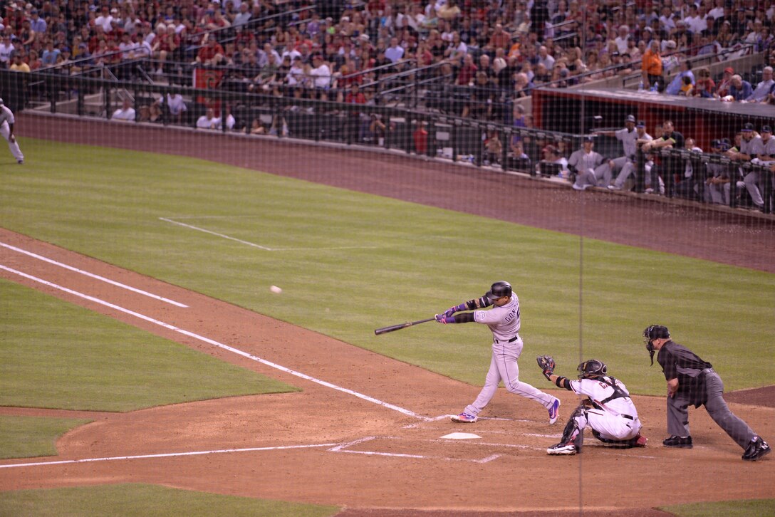 Colorado Rockies’ right fielder Carlos Gonzalez bats the baseball hard into the outfield against the Arizona Diamondbacks at Chase Field ballpark in Phoenix, Ariz. on April 4th, 2016. (U.S. Air Force photo by Airman 1st Class Ridge Shan)