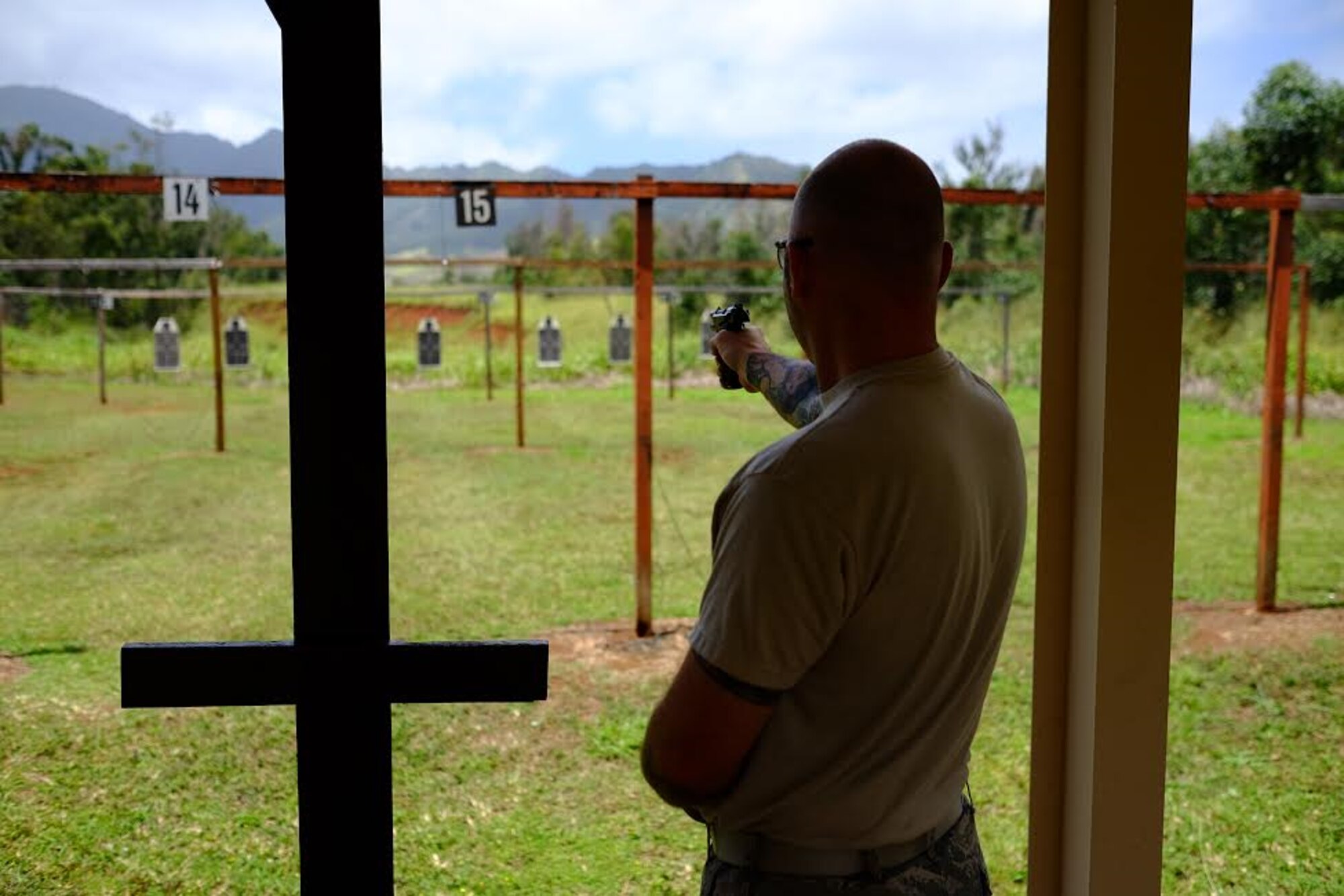 Master Sgt. Erich Freundner, 690th Cyberspace Operations Squadron, fires his Beretta M9 pistol during the Excellence in Competition pistol event, held 29-31 March, at the 647th SFS Combat Arms Firing Range on Schofield Barracks. (U.S. Air Force photo by Staff Sgt. Christopher Stoltz/Released)