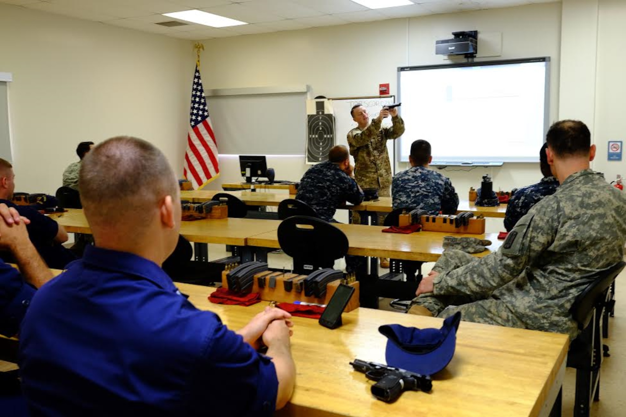 Staff Sgt. Jordan Locke, 647th Security Forces Squadron Combat Arms instructor, provides a weapon safety class prior to the Excellence in Competition event, held 29-31 March at the 647th SFS Combat Arms Firing Range on Schofield Barracks. (U.S. Air Force photo by Staff Sgt. Christopher Stoltz)