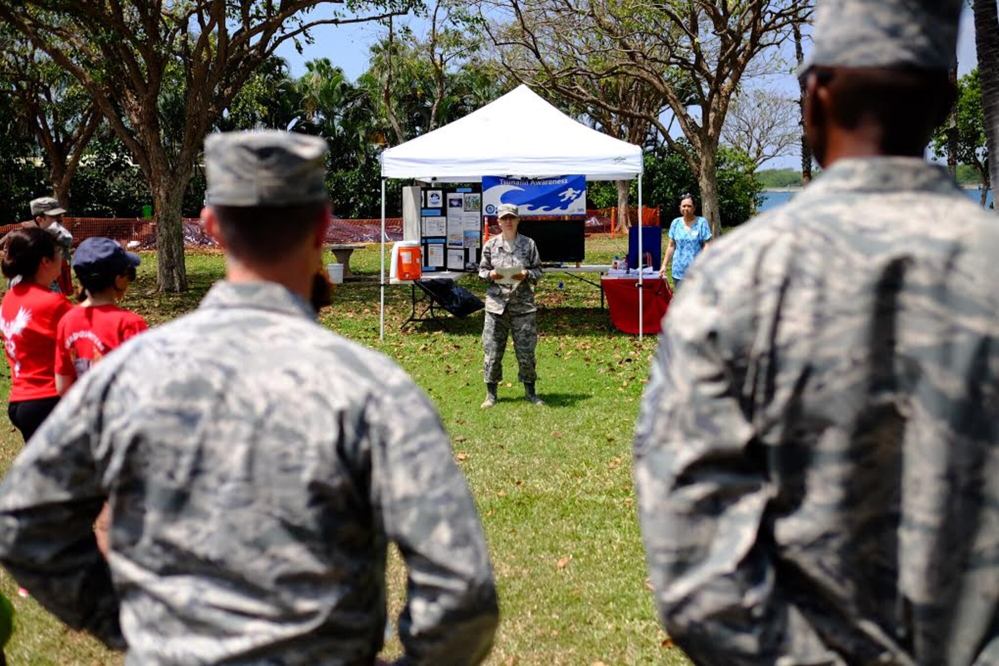 Staff Sgt. Sally Mason speaks to the crowd before the start of the fourth-annual ‘One Mile Walk to Safety’  here, on April 1, 2016. The Walk to Safety is planned in conjunction with NOAA, state civil defense, City and County of Honolulu departments of emergency management and the American Red Cross and serves to raise awareness for the potential tsunami threat Hawaii faces. (U.S. Air Force photo by Staff Sgt. Christopher Stoltz/Released)
