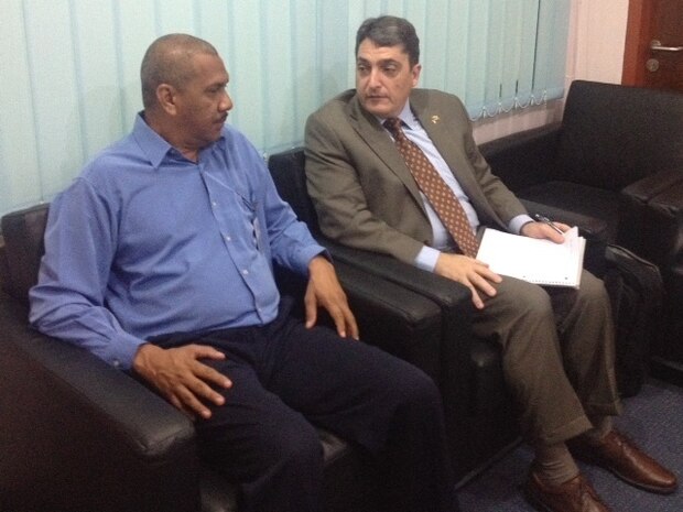 A U.S. Coast Guard International Port Security Program representative discusses security measures with the Security Manager at Muara Serasa Ferry Terminal in Brunei. (U.S. Coast Guard photo by Activities Far East/Released)