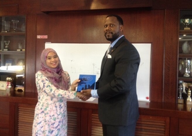 A U.S. Coast Guard International Port Security representative presents a plaque to the Ministry of Communications in appreciation for their commitment to improving port security in Brunei, in March. (U.S. Coast Guard photo by Activities Far East/Released)
