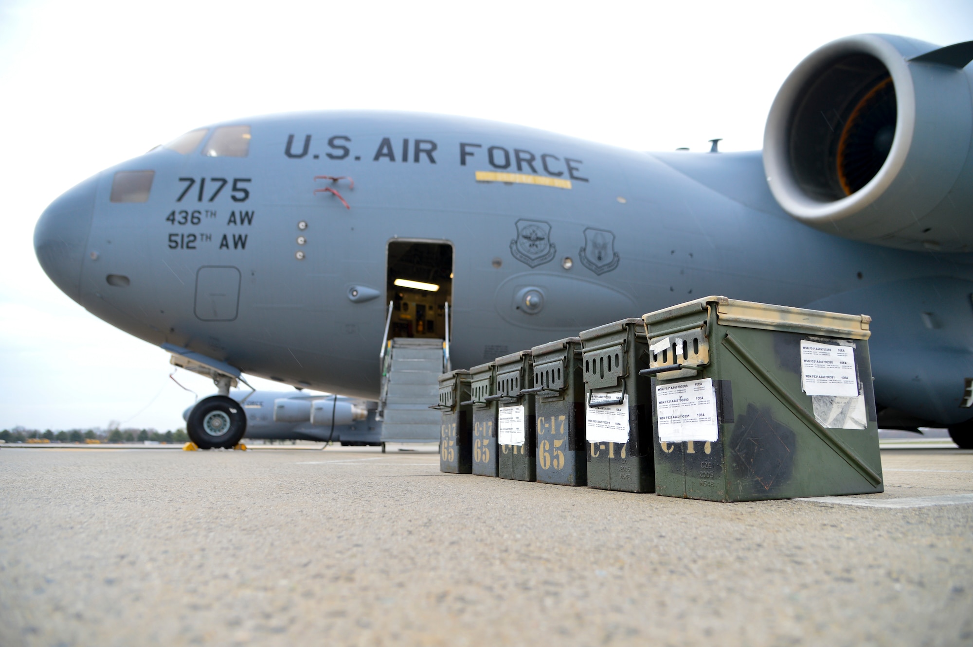A flare set sits on the flight line next to a C-17A Globemaster III while preparations are made to the aircraft to upload the flares March 25, 2016, at Dover Air Force Base Del. The C-17 can hold up to 240 flare sticks, capable of defeating a wide range of infrared threats. (U.S. Air Force photo/Senior Airman William Johnson)