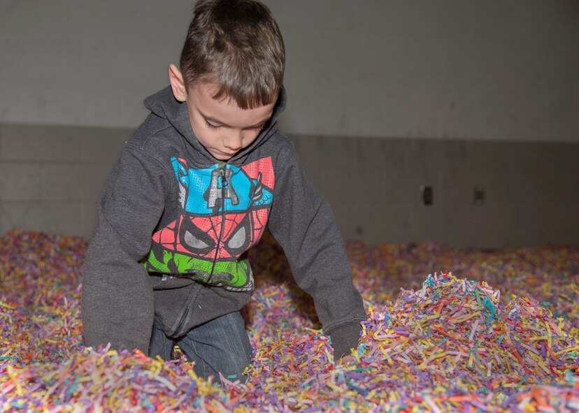 A Minot Youth Center member looks for the golden egg during the Youth Center’s Easter Eggstravaganza at Minot Air Force Base, N.D., March 25, 2016. At the event, kids could hunt for the golden egg, play different Easter themed games and take a stroll through Candyland. (U.S. Air Force photo/Airman 1st Class Christian Sullivan)