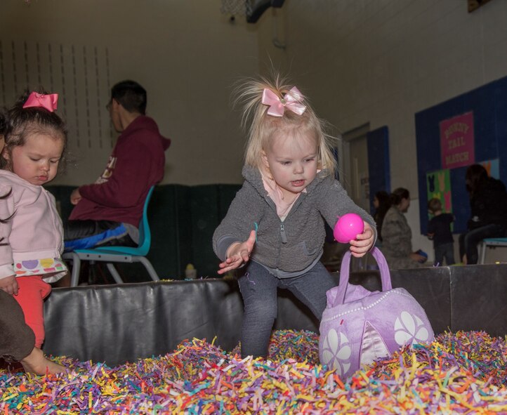 A Minot Youth Center member hunts for the golden egg during the Youth Center’s Easter Eggstravaganza at Minot Air Force Base, N.D., March 25, 2016. At the event kids could hunt for the golden egg, play different Easter themed games and take a stroll through Candyland. (U.S. Air Force photo/Airman 1st Class Christian Sullivan)