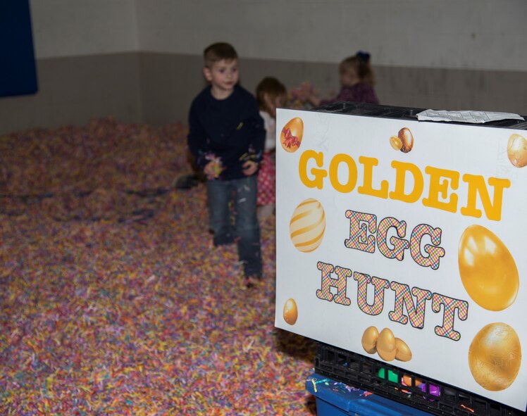 Minot Youth Center members hunt for the golden egg during the Youth Center’s Easter Eggstravaganza at Minot Air Force Base, N.D., March 25, 2016. At the event, kids could look for the golden egg, play different Easter themed games and take a stroll through Candyland. (U.S. Air Force photo/Airman 1st Class Christian Sullivan)