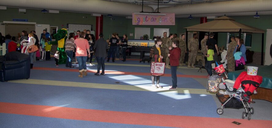 Minot youth and parents take in the excitement that is the Youth Center’s celebration of Easter, the “Eggstravaganza”, at Minot Air Force Base, N.D., March 25, 2016. At the event kids, could hunt for the golden egg, play different Easter themed games and take a stroll through Candyland. (U.S. Air Force photo/Airman 1st Class Christian Sullivan)