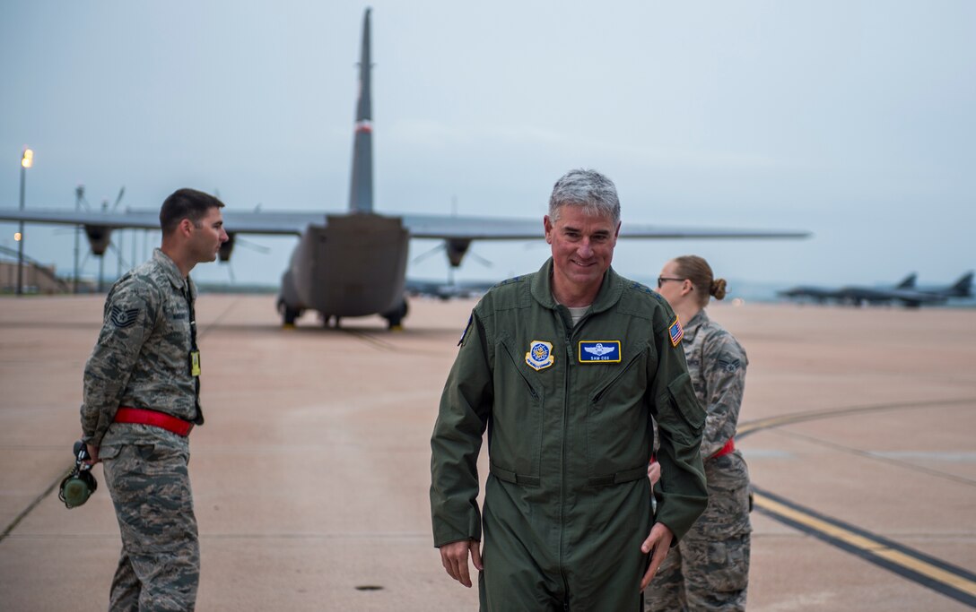 U.S. Air Force Lt. Gen. Sam Cox, 18th Air Force commander, walks down the flightline before flying in a C-130J Super Hercules, March 30, 2016, at Dyess Air Force Base, Texas. Cox spent his time at Dyess learning about the 317th Airlift Group mission and the Airmen who keep the C-130J Super Hercules mission-capable. The 317th AG consists of five squadrons and approximately 1,100 aviators, maintenance professionals, and support personnel, as well as 27 C-130J aircraft engaged in worldwide combat aerial delivery operations. (U.S. Air Force photo by Airman 1st Class Quay Drawdy/Released)