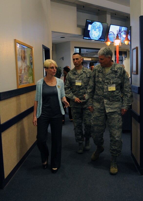 Tracie Lindquist, left, Child Development Center director, speaks with Lt. Gen. Sam Cox, right, 18th Air Force commander, and Chief Master Sgt. Todd Petzel, 18th AF command chief, center, March 29, 2016, at Dyess Air Force Base, Texas. Lindquist has been the CDC director for almost a year, and ensures all 218 children, currently enrolled there, are adequately cared for. (U.S. Air Force photo by Senior Airman Shannon Hall/Released)