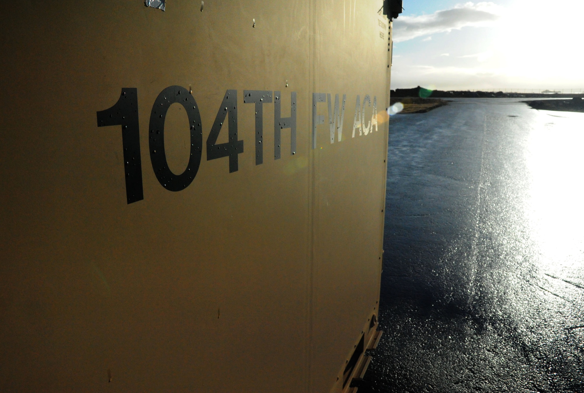 A supply container from the 104th Fighter Wing, Barnes Air National Guard Base, Mass., sits near the flightline at Keflavik International Airport, Iceland, April 2, 2016. Airmen of the 104th Maintenance Squadron worked through the weekend preparing facilities and recovery equipment prior to the arrival of four F-15C Eagle fighter aircraft from Massachusetts April 3, 2016, to conduct Icelandic Air Surveillance operations throughout April. (U.S. Air Force photo by Master Sgt. Kevin Nichols/Released)