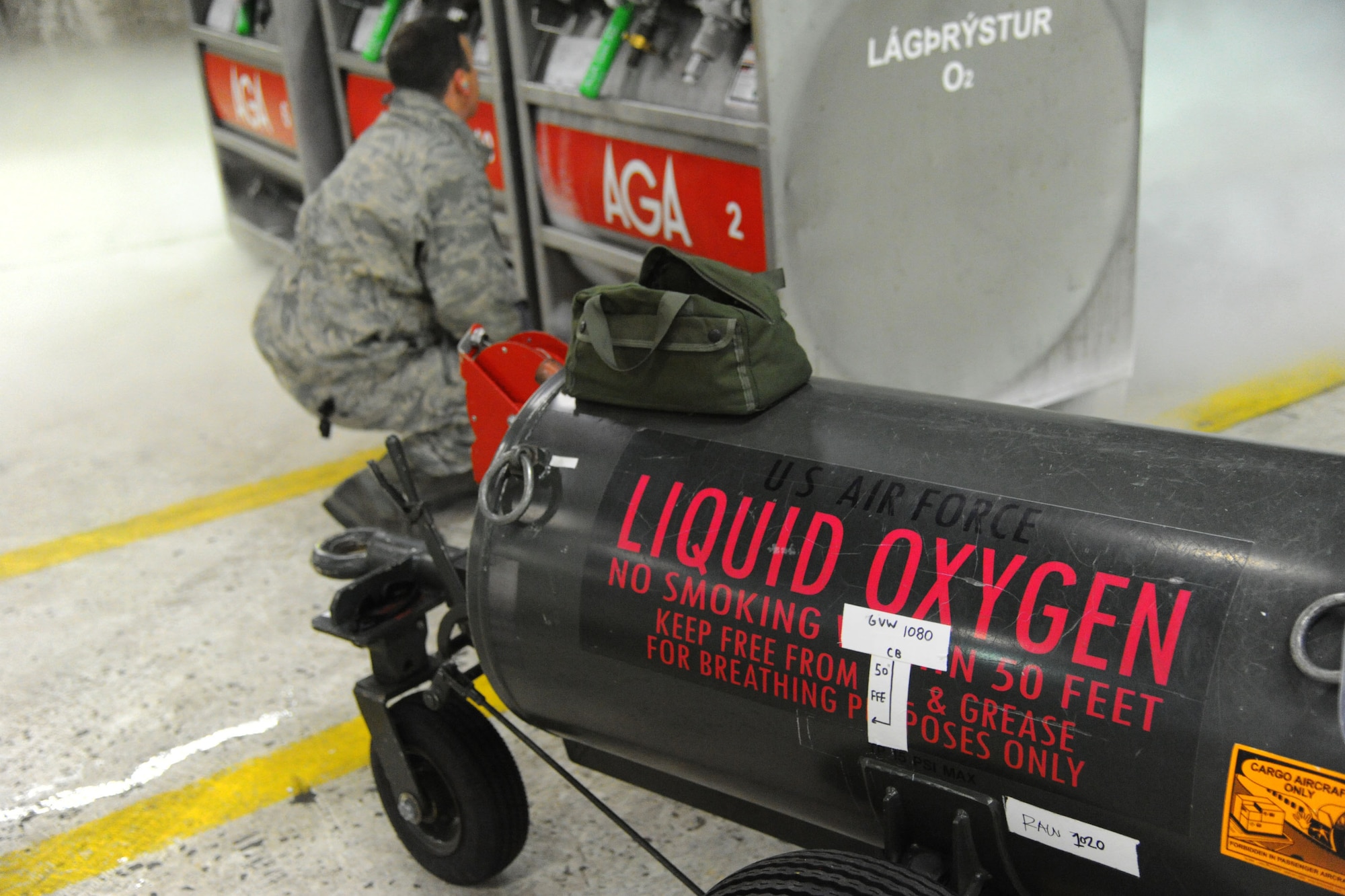 U.S. Air Force Master Sgt. Matt Leonard, an electro-environmental technician assigned to the 104th Maintenance Group, Barnes Air National Guard Base, Mass., inspects liquid oxygen tanks in a hardened aircraft shelter at Keflavik International Airport, Iceland, April 2, 2016. The tanks must be tested and fitted to the portable tank before transferring the liquid oxygen that will be used to replenish pilots’ oxygen supplies within the aircraft. (U.S. Air Force photo by Master Sgt. Kevin Nichols)