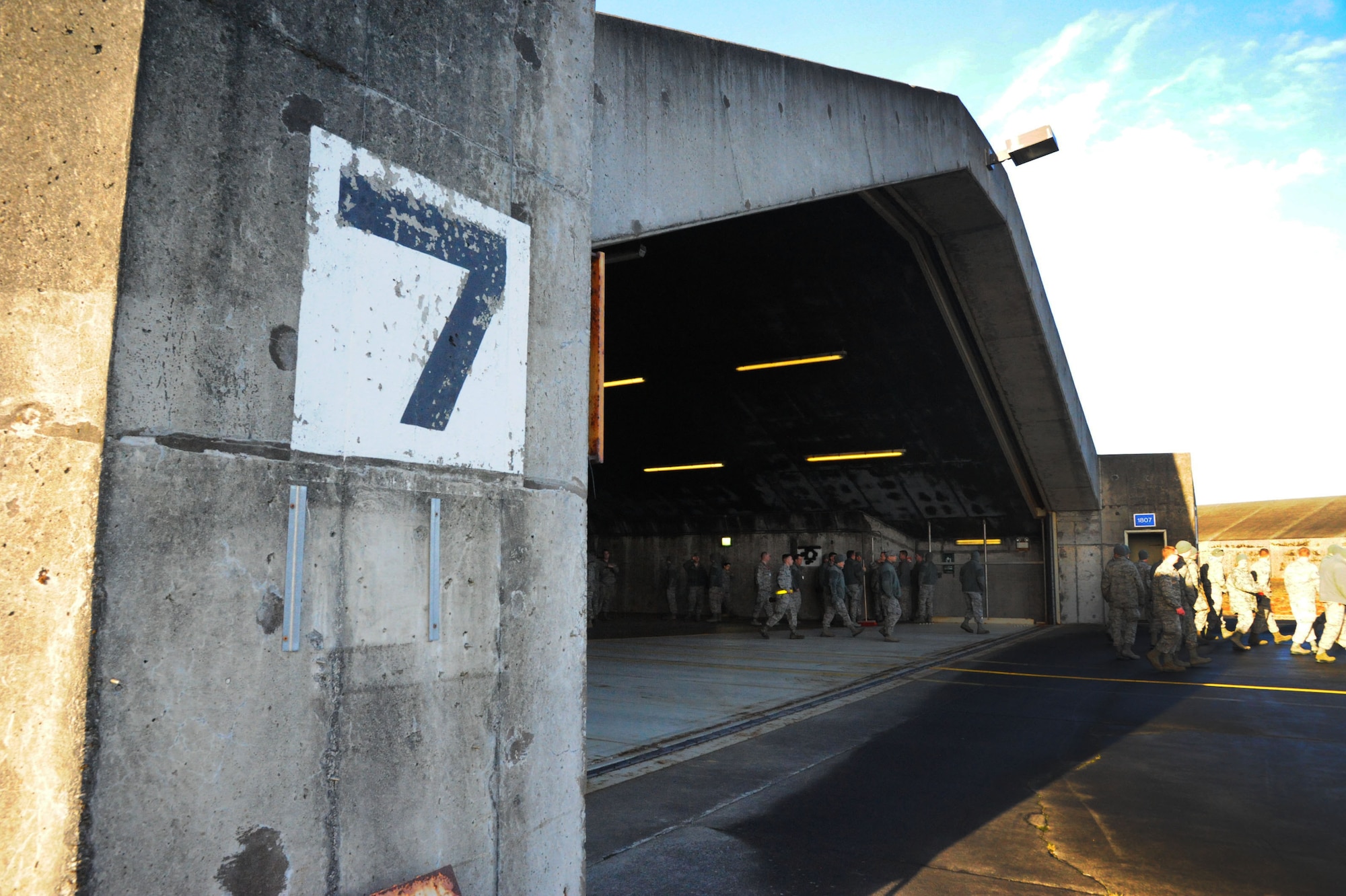 U.S. Air Force members assigned to the 104th Fighter Wing, Barnes Air National Guard Base, Mass., prepare and inspect hardened aircraft shelters at Keflavik International Airport, Iceland, April 2, 2016. Approximately 200 Airmen and four F-15C Eagle fighter aircraft from the 131st Fighter Squadron and 194th Fighter Squadron, Air National Guard Base, Calif., deployed to Iceland to conduct annual Icelandic Air Surveillance operations April 1-28, 2016. (U.S. Air Force photo by Master Sgt. Kevin Nichols/Released)