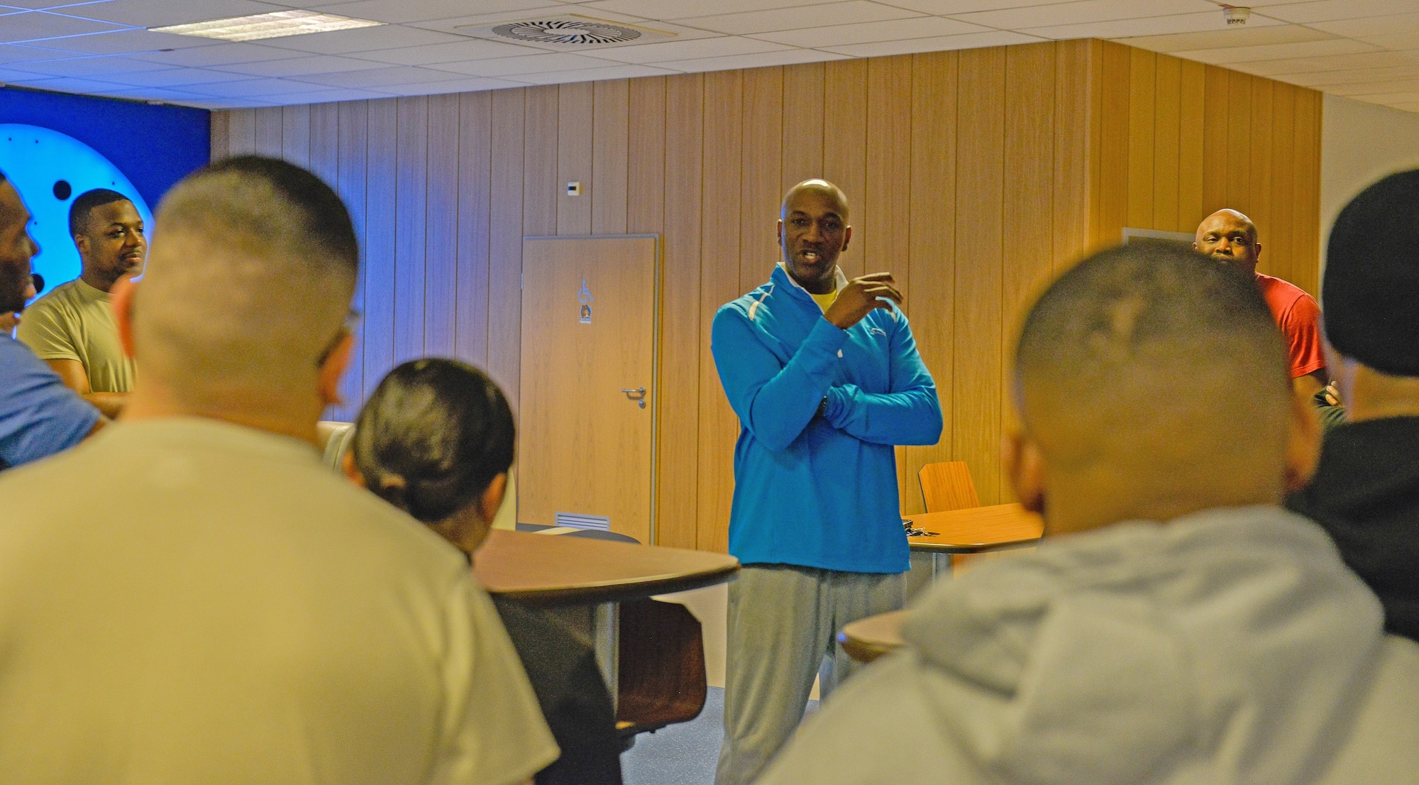 Chief Master Sgt. Kaleth Wright, 3rd Air Force command chief, talks to Airmen at The Huddle March 30, 2016, at Ramstein Air Base, Germany. The Huddle is a hangout for Airmen to meet leaders around Ramstein, who mentor and help them grow professionally in a relaxed environment. (U.S. Air force photo/Airman 1st Class Lane T. Plummer). 