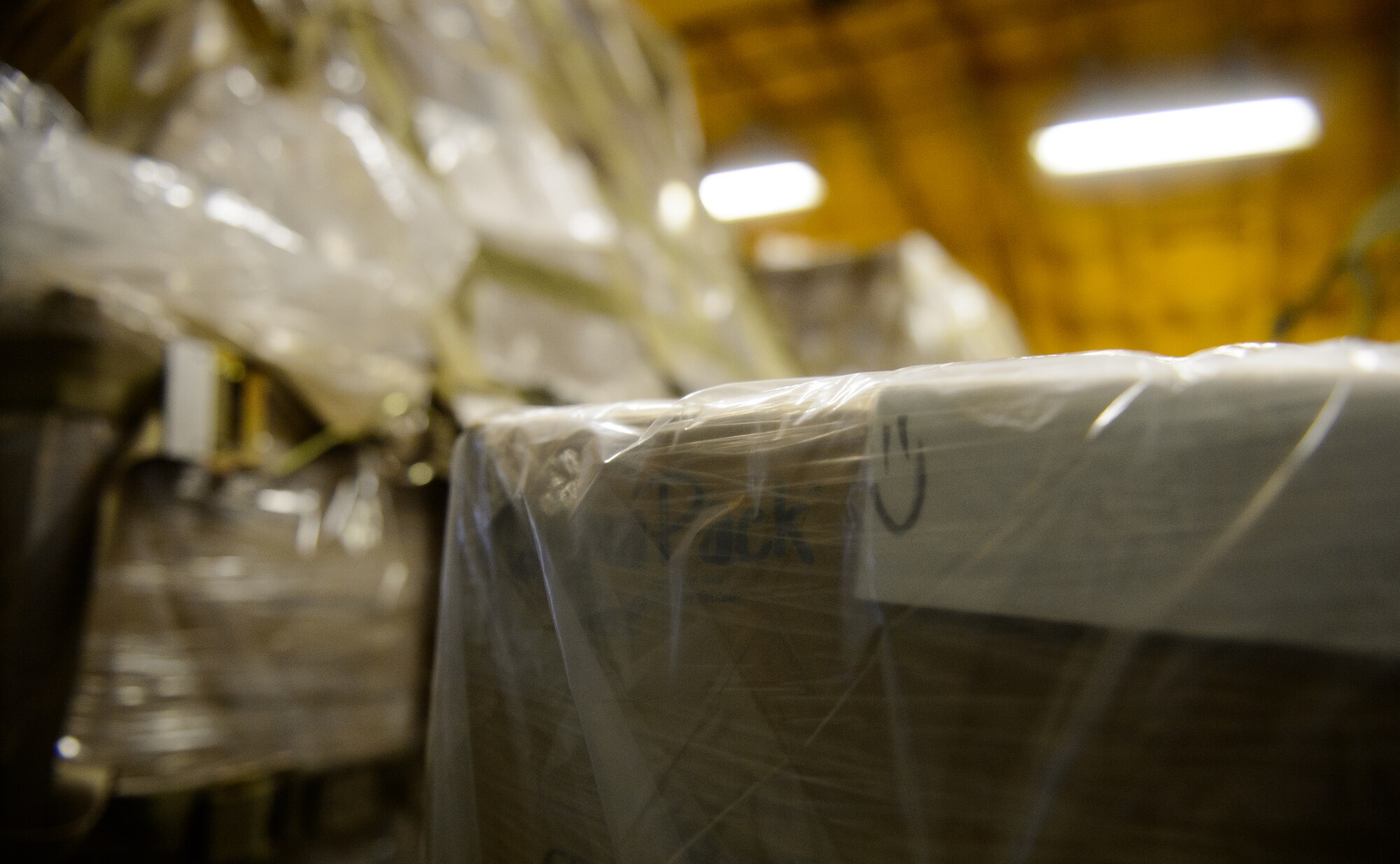 Cargo pallets wait as Airmen from the 521st Air Mobility Operations Wing offload them from a KC-10 Extender March 25, 2016, at Ramstein Air Base, Germany. Cargo regularly flows through Ramstein’s ramps however the cargo brought by the KC-10 was to provide meals for children in need. (U.S. Air Force photo/Staff Sgt. Armando A. Schwier-Morales)