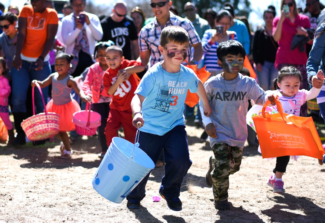PETERSON AIR FORCE BASE, Colo. - Team Pete children race to collect eggs during the 21st Force Support Squadron’s Egg-stravaganza at the Capt. David Lyon Memorial Park at Peterson Air Force Base on April 2, 2016. The egg hunt was split up into several age groups and averaged 40 children per group. (U.S. Air Force photo by Airman 1st Class Dennis Hoffman)