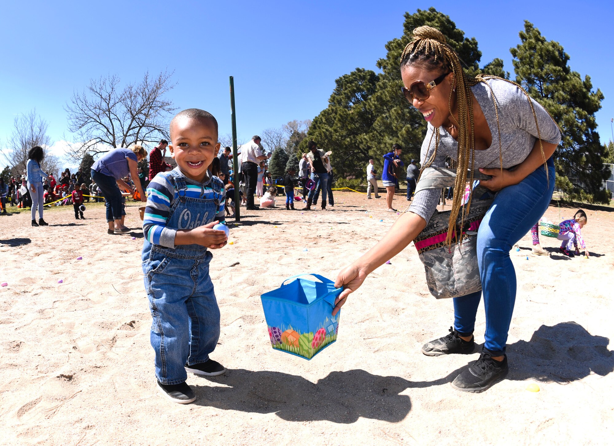 PETERSON AIR FORCE BASE, Colo. - Team Pete children participate in the 21st Force Support Squadron’s Egg-stravaganza at the Capt. David Lyon Memorial Park at Peterson Air Force Base on April 2, 2016. More than 8,000 multicolored Easter eggs were prepared for the hunt. (U.S. Air Force photo by Airman 1st Class Dennis Hoffman)