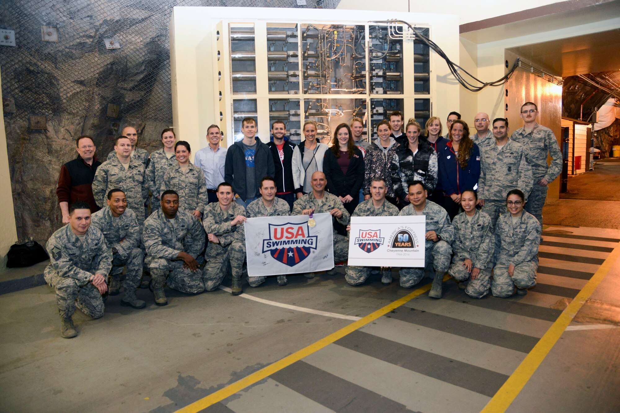 CHEYENNE MOUNTAIN AIR FORCE STATION – Members of the U.S. National Swim Team visited, toured and spent time with the Airmen “Behind the Blast Doors” here March 30, 2016. Cheyenne Mountain is one of the most secure facilities in the Department of Defense. It became fully operational April 20, 1966 after nearly six years of construction. The ceremony to celebrate the 50th Anniversary is scheduled for April 15. (U.S. Air Force photo by Master Sgt. Jared Marquis)