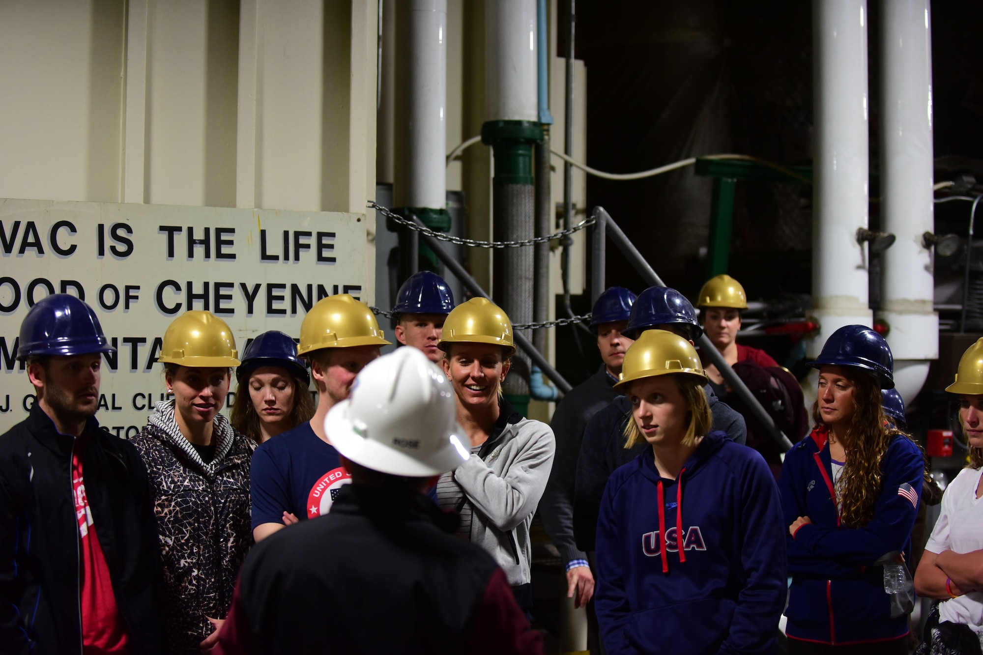 CHEYENNE MOUNTAIN AIR FORCE STATION – Members of the U.S. National Swim Team listen as Steven Rose, 721st Mission Support Group deputy director, gives a tour of the facilities here March 30, 2016. The visit and tour was part of the ongoing 50th Anniversary celebration for CMAFS. The installation was declared fully operational April 20, 1966. (U.S. Air Force photo by Staff Sgt. Amber Grimm)