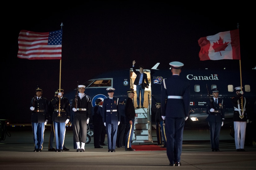 Members of Joint Base Andrews prepare for the arrival of Justin Trudeau, Prime Minister of Canada, on the JBA flightline March 30, 2016. More than 20 countries arrived here for the 2016 Nuclear Security Summit held in Washington, D.C. The summit provides a forum for leaders to reinforce commitments to securing nuclear materials. (U.S. Air Force photo by Senior Airman Mariah Haddenham/RELEASED)