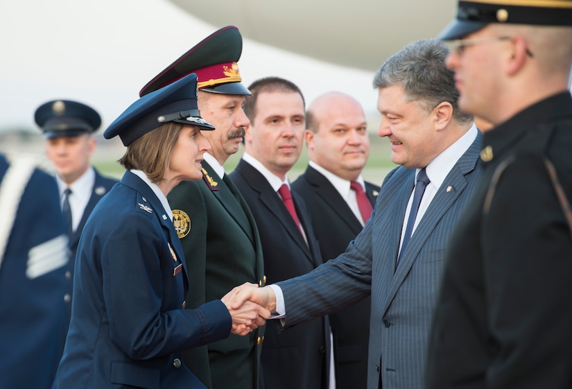 Col. Tiffany Dawson, 11th Wing Staff Judge Advocate director, greets Petro Poroshenko, Ukraine’s president, on Joint Base Andrews, Md., March 30, 2016. Poroshenko, along with more than 20 other foreign leaders, arrived here for the 2016 Nuclear Security Summit held in Washington, D.C. The summit provides a forum for leaders to reinforce commitments to securing nuclear materials. (U.S. Air Force photo by Senior Airman Ryan J. Sonnier/RELEASED)