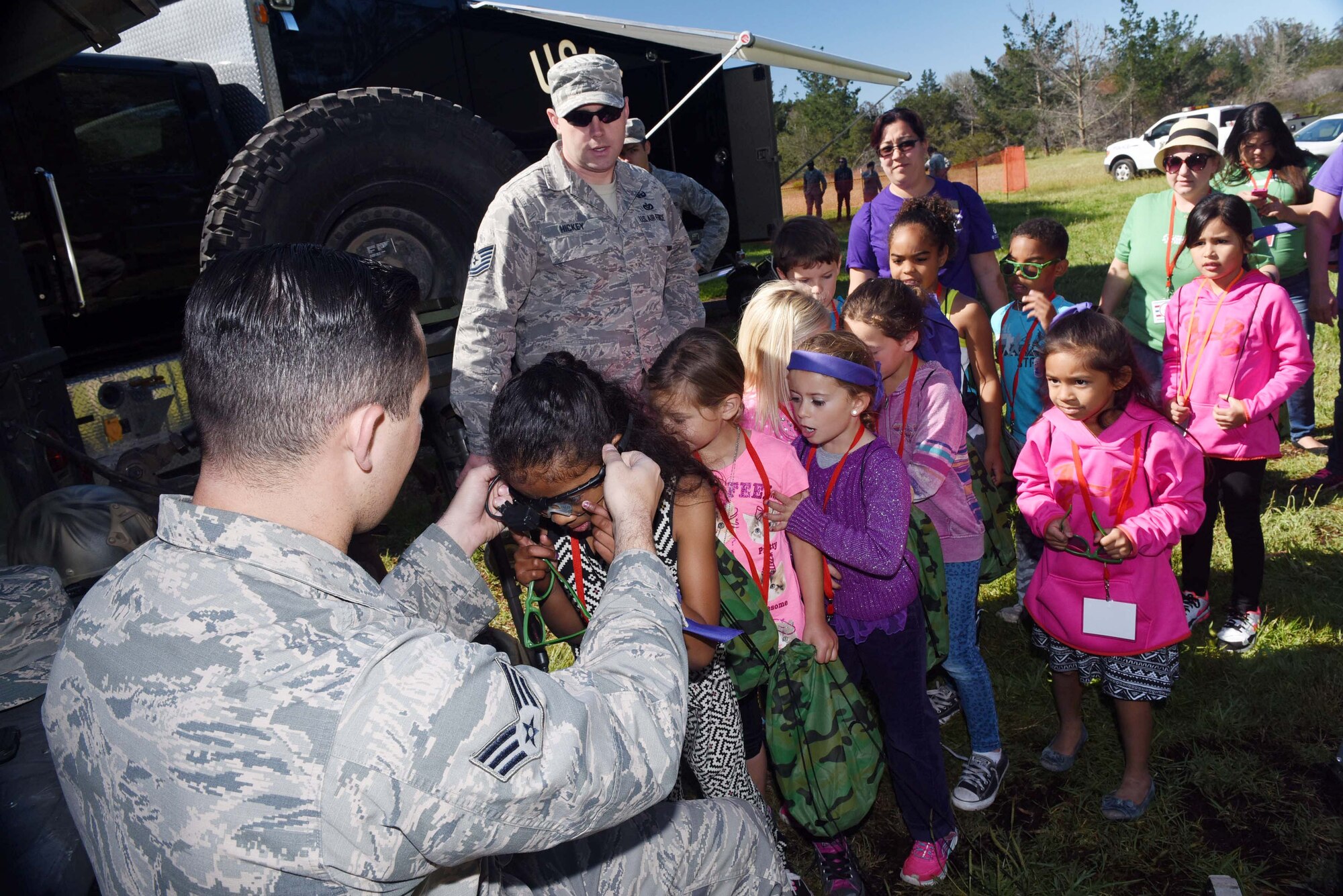 Senior Airman Kenneth Maurer, 30th Civil Engineer Squadron explosive ordnance disposal journeyman, demonstrates EOD robotic capabilities during Kids Understanding Deployment Operations, March 29, 2016, Vandenberg Air Force Base, Calif. KUDOS is a program developed to give children a deeper understanding of the military deployment process and equipment utilized during a deployment. (U.S. Air Force photo by Staff Sgt. Jim Araos/Released)