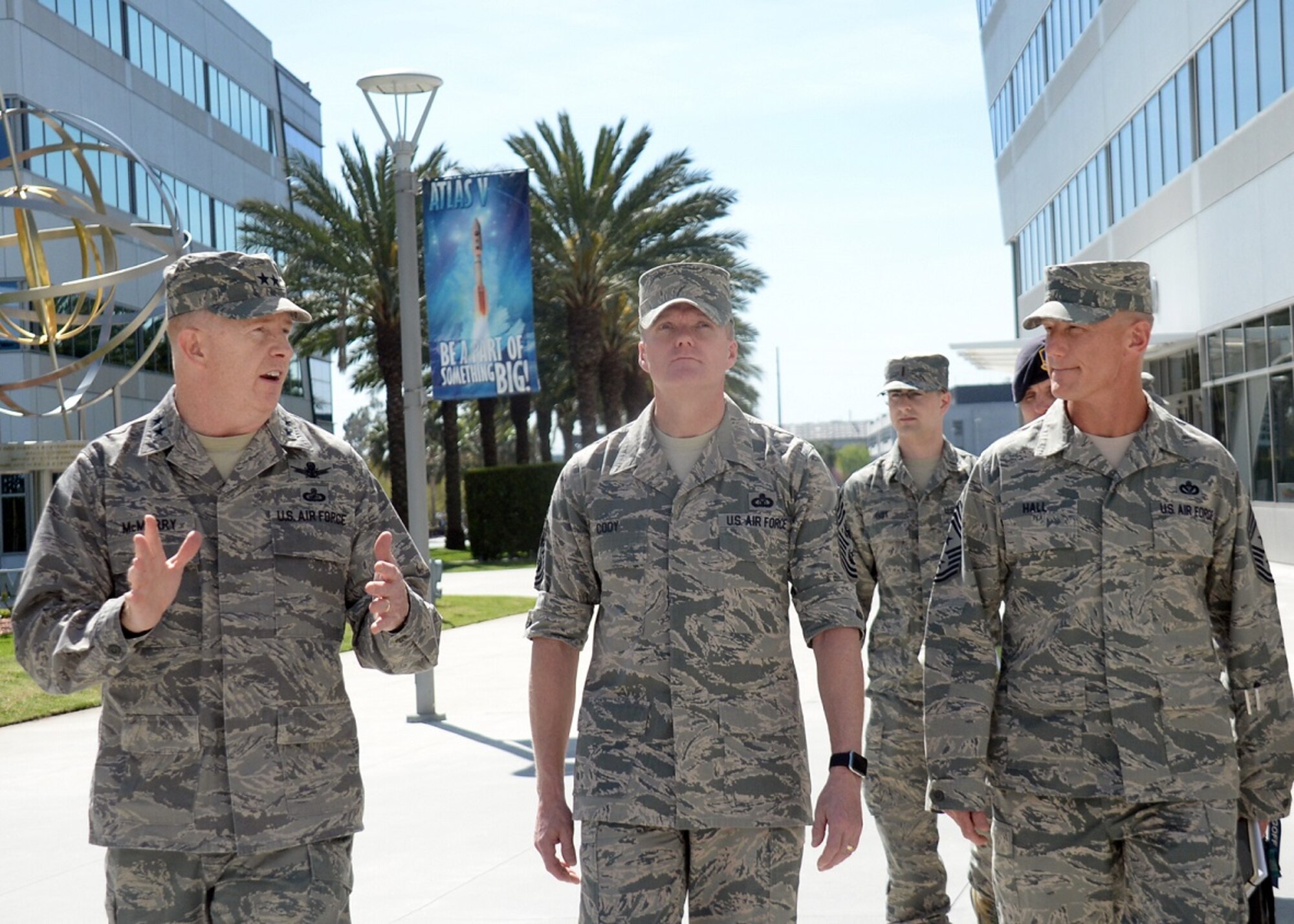 Chief Master Sgt. of the Air Force James A. Cody (center) is escorted by Maj. Gen. Robert McMurry, Space and Missile Systems Center vice commander and Chief Master Sgt. Craig Hall, SMC command chief, during a visit to Los Angeles Air Force Base in El Segundo, Calif., March 9-11, 2016 to discuss the current state of the Air Force from an enlisted perspective. The CMSAF's visit offered active duty and civilian personnel a rare opportunity to directly address the service’s senior enlisted leader regarding the issues facing today’s Airmen. It also gave Chief Cody a chance to view the unique characteristics of Los Angeles AFB and the capabilities the Total Force offers to accomplish the SMC mission. (U.S. Air Force photo/Van De Ha)