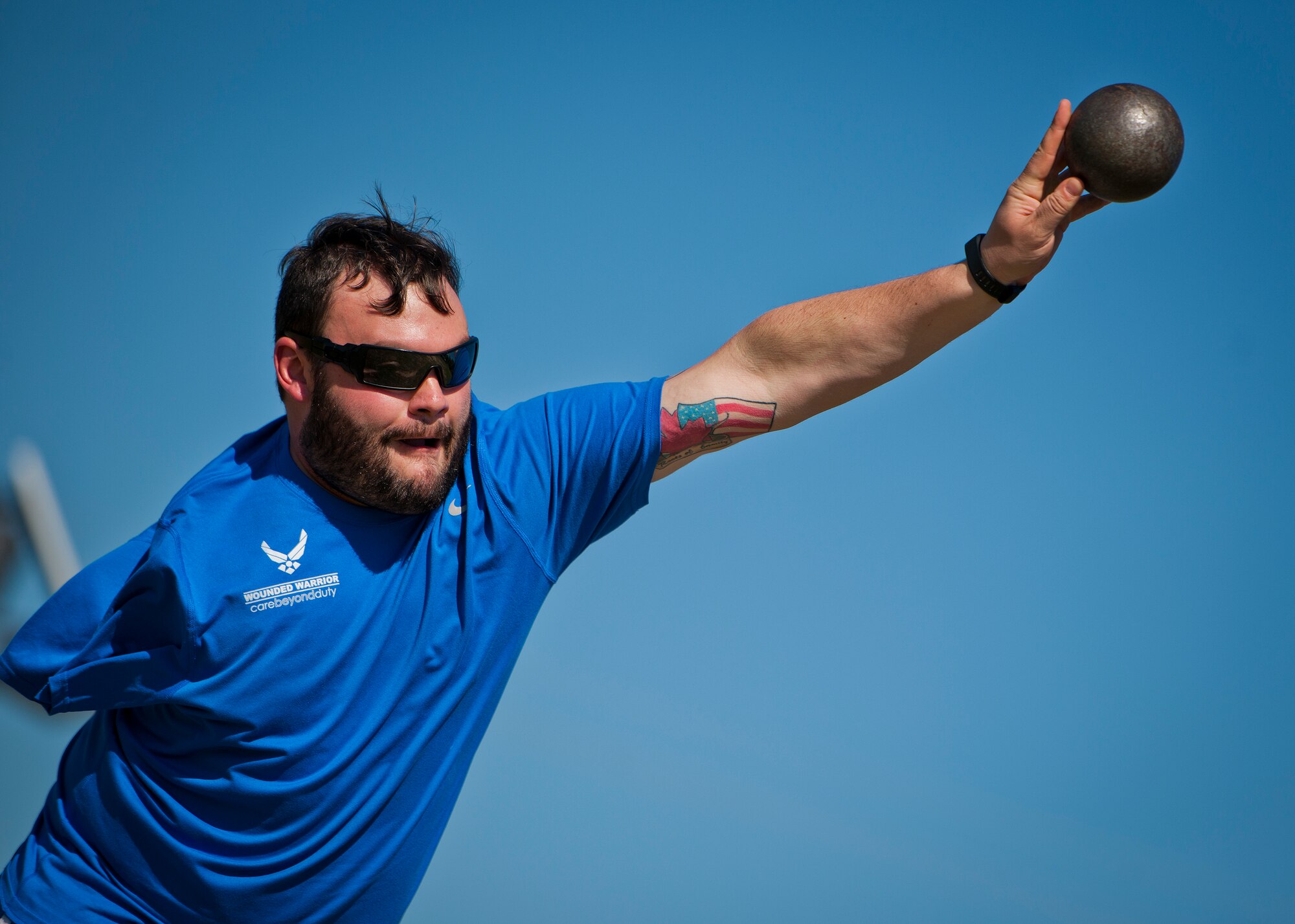 Lucas Purser, a Warrior Games athlete, releases his toss during an afternoon track and field session at the Air Force team’s training camp at Eglin Air Force Base, Fla., April 4.  The base-hosted, week-long Warrior Games training camp is the last team practice session before the yearly competition in June.  (U.S. Air Force photo/Samuel King Jr.)