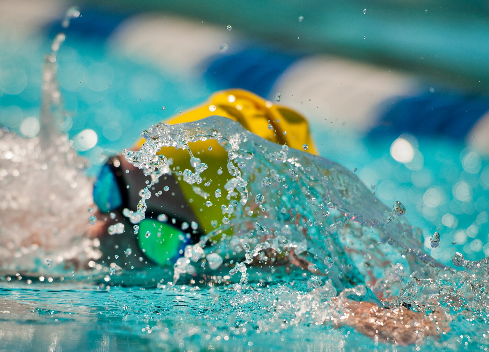 Hanna Stulberg, a Warrior Care attendee, swims laps during an afternoon training session at the adaptive sports camp at Eglin Air Force Base, Fla., April 4.  The base hosts the week-long Wound Warrior CARE event that helps recovering wounded, ill and injured military members through specific hand-on rehabilitative training.  (U.S. Air Force photo/Samuel King Jr.)
