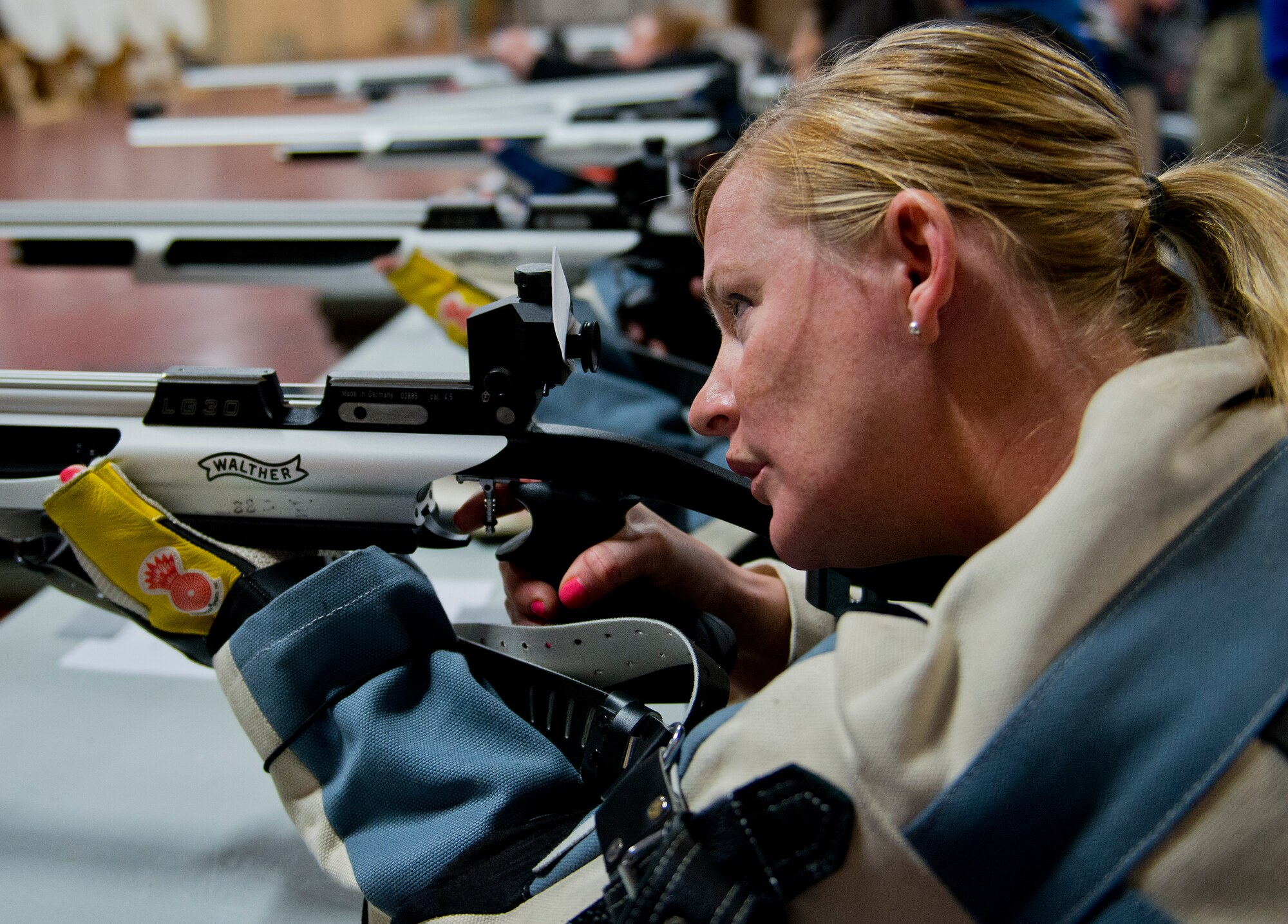 Amy Mlekoday, a Warrior Games athlete, aims her rifle during a morning target-shooting session at the Air Force team’s training camp at Eglin Air Force Base, Fla., April 4.  The base-hosted, week-long Warrior Games training camp is the last team practice session before the yearly competition in June.  (U.S. Air Force photo/Samuel King Jr.)
