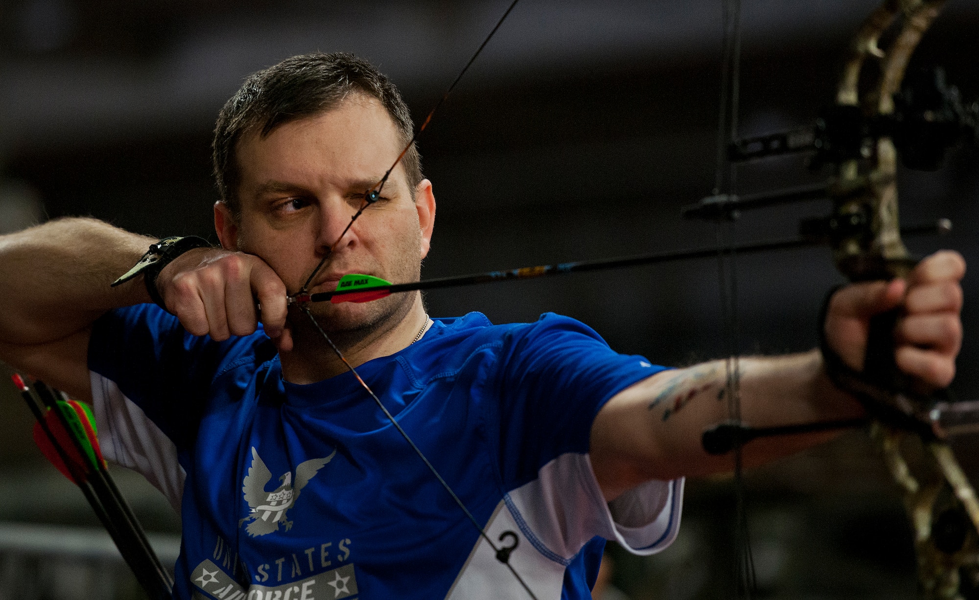 Brian Schaaf, a Warrior Games athlete, pulls back his bow string during a morning archery session at the Air Force team’s training camp at Eglin Air Force Base, Fla., April 4.  The base-hosted, week-long Warrior Games training camp is the last team practice session before the yearly competition in June.  (U.S. Air Force photo/Samuel King Jr.)