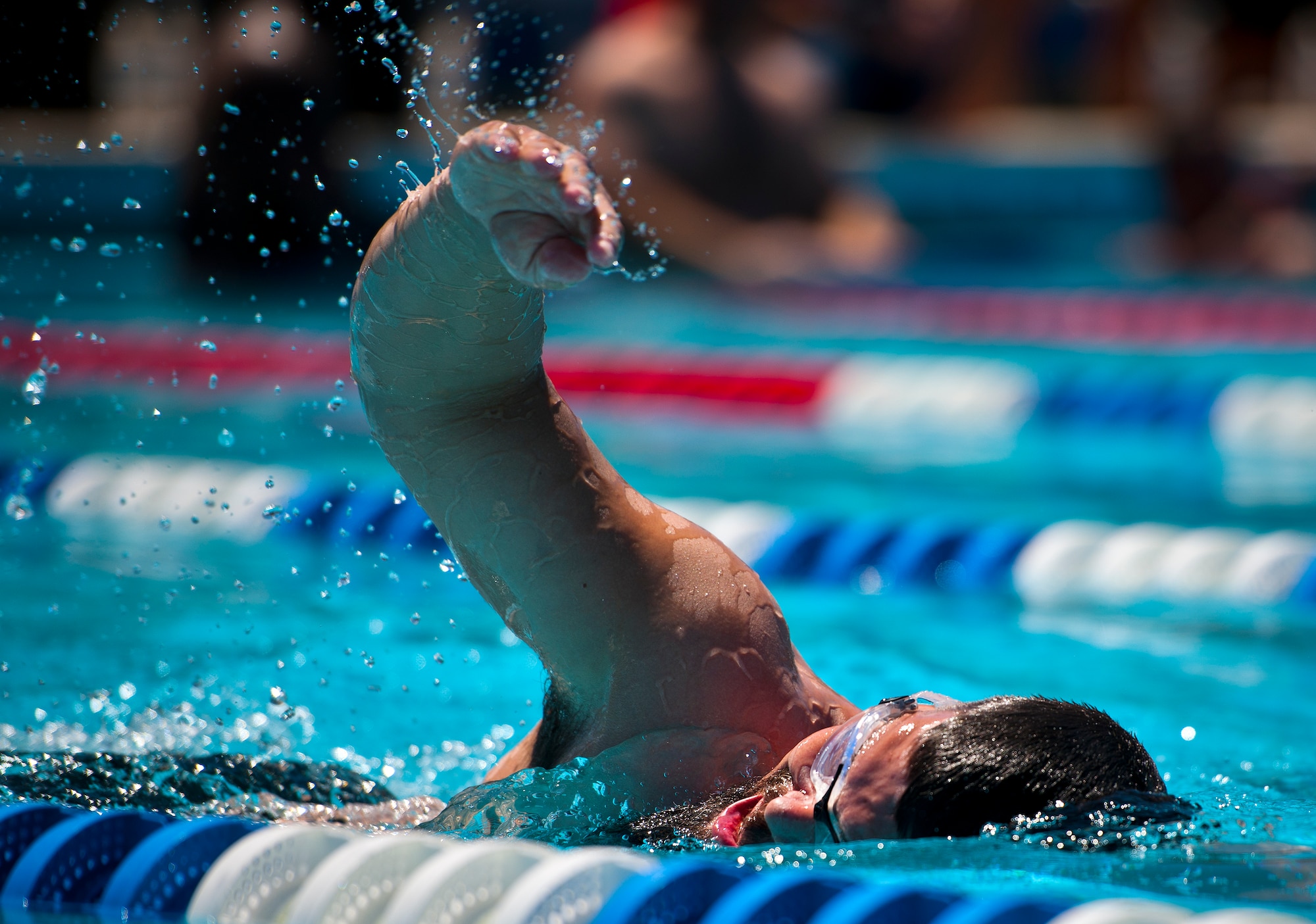 Courtney Hinson, a Warrior Care attendee, swims laps during an afternoon training session at the adaptive sports camp at Eglin Air Force Base, Fla., April 4.  The base hosts the week-long Wound Warrior CARE event that helps recovering wounded, ill and injured military members through specific hand-on rehabilitative training.  (U.S. Air Force photo/Samuel King Jr.)