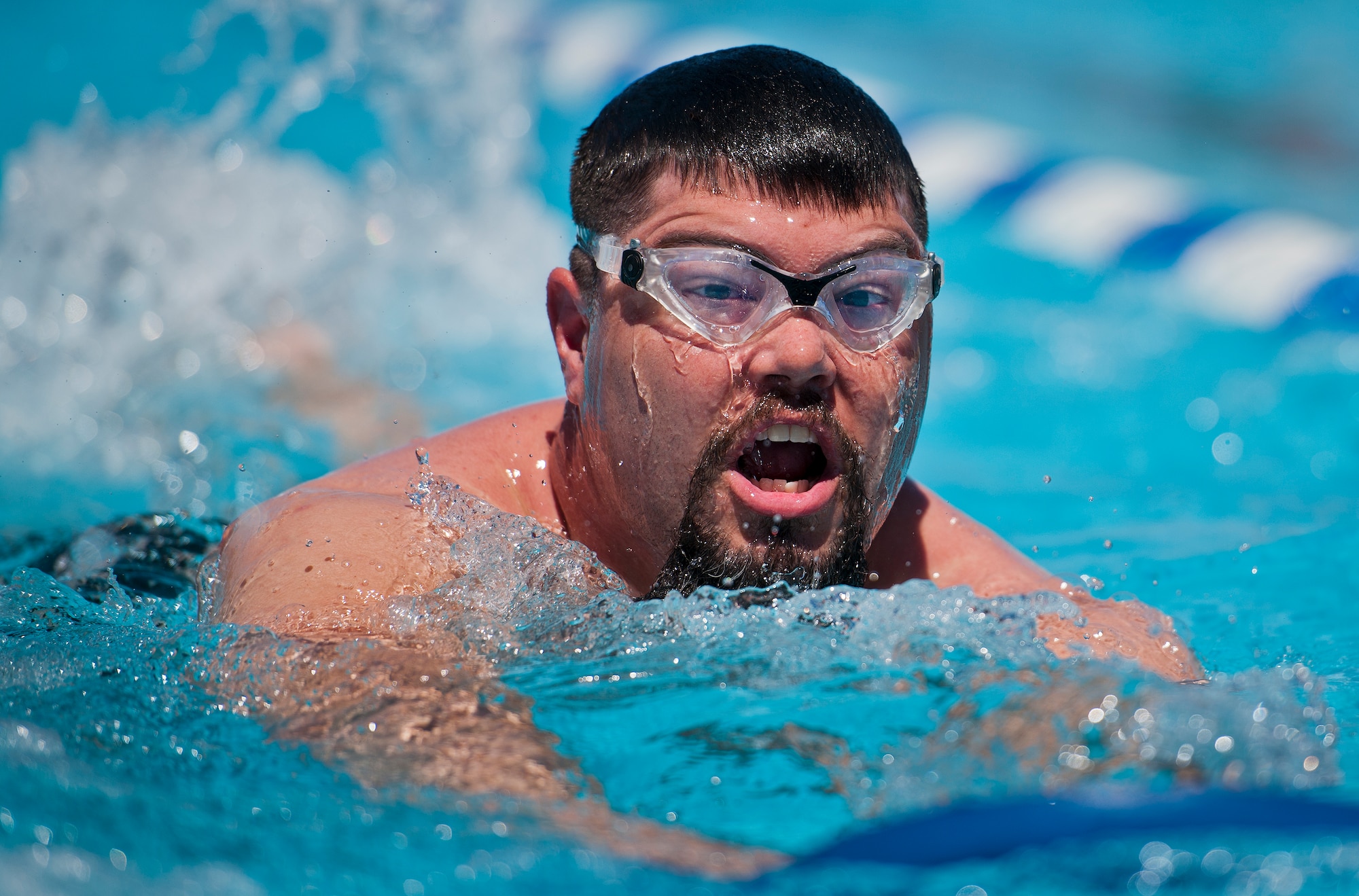 Courtney Hinson, a Warrior Care attendee, swims laps during an afternoon training session at the adaptive sports camp at Eglin Air Force Base, Fla., April 4.  The base hosts the week-long Wound Warrior CARE event that helps recovering wounded, ill and injured military members through specific hand-on rehabilitative training.  (U.S. Air Force photo/Samuel King Jr.)