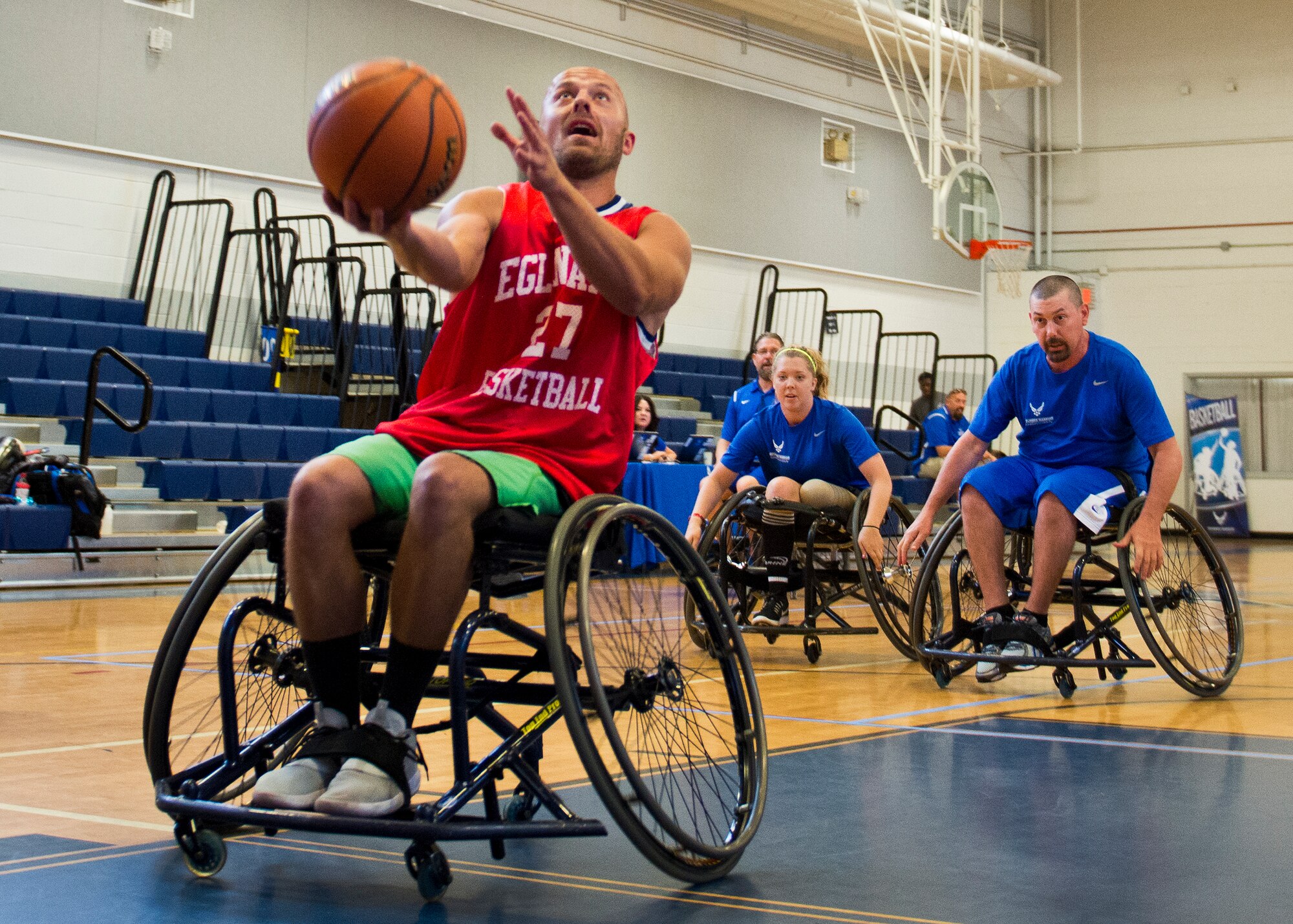 Arthur Zingler, a Warrior Care attendee, tries a lay-up off a fast break during a wheelchair basketball session at the adaptive sports camp at Eglin Air Force Base, Fla., April 4.  The base hosts the week-long Wound Warrior CARE event that helps recovering wounded, ill and injured military members through specific hand-on rehabilitative training.  (U.S. Air Force photo/Samuel King Jr.)