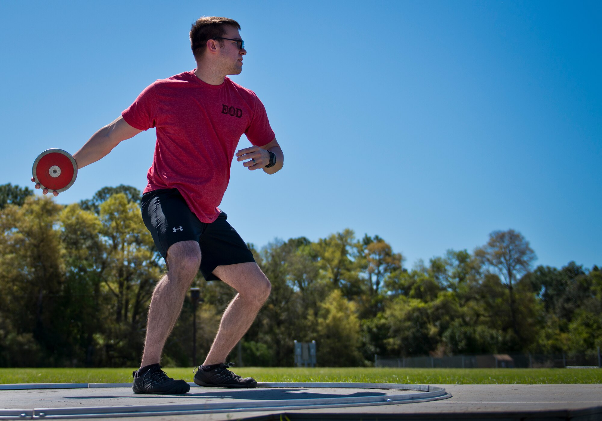 A Warrior Care volunteer throws the discus during a morning track and field session at the adaptive sports camp at Eglin Air Force Base, Fla., April 4.  The base hosts the week-long Wound Warrior CARE event that helps recovering wounded, ill and injured military members through specific hand-on rehabilitative training.  (U.S. Air Force photo/Samuel King Jr.)