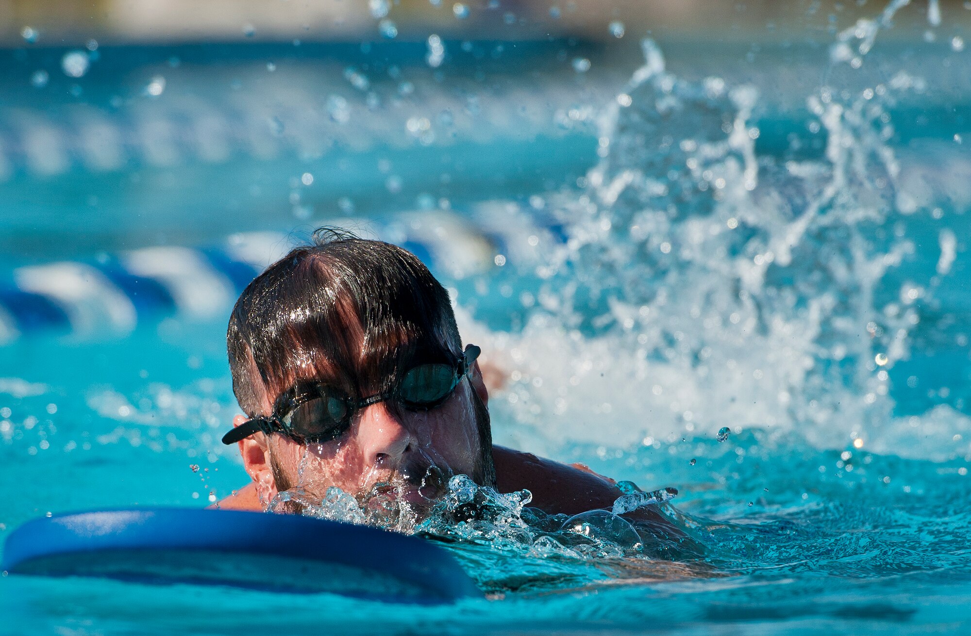 Rob Harper, a Warrior Games athlete, swims laps during an afternoon training session at the adaptive sports camp at Eglin Air Force Base, Fla., April 4.  The base-hosted, week-long Warrior Games training camp is the last team practice session before the yearly competition in June.  (U.S. Air Force photo/Samuel King Jr.)