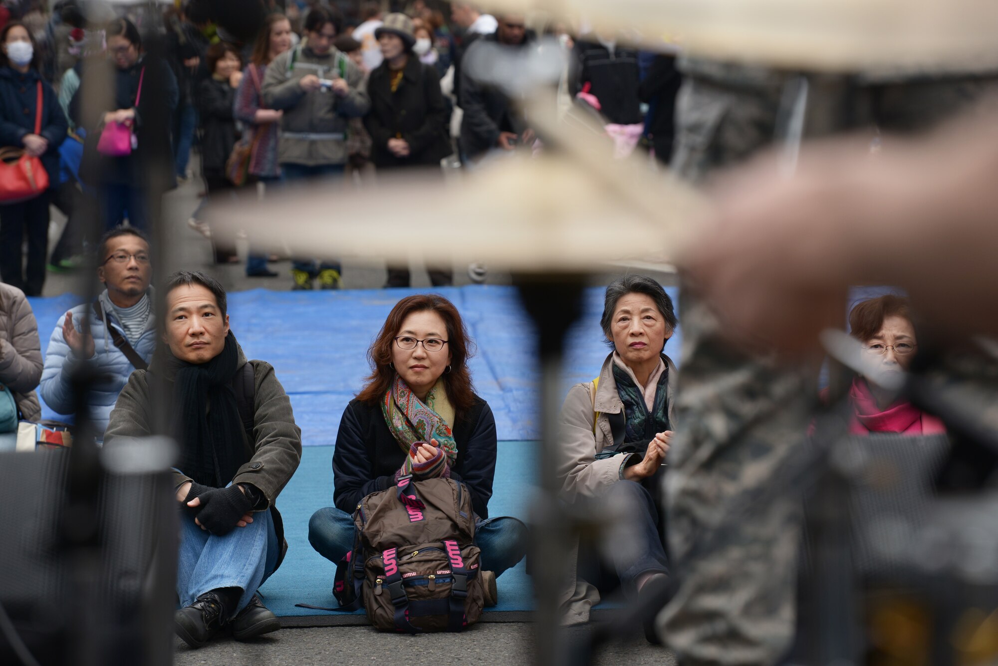 Festivalgoers watch the Band of the Pacific-Asia perform during the Sakura Spring Festival at Yokota Air Base, Japan, April 2, 2016. The festival consisted of band performances, dancers, Taiko drummers and food booths, offering a chance for Japanese citizens to experience American culture within the base’s perimeter. Approximately 5,000 people attended the event to celebrate the coming of spring. (U.S. Air Force photo by Staff Sgt. Cody H. Ramirez/Released)