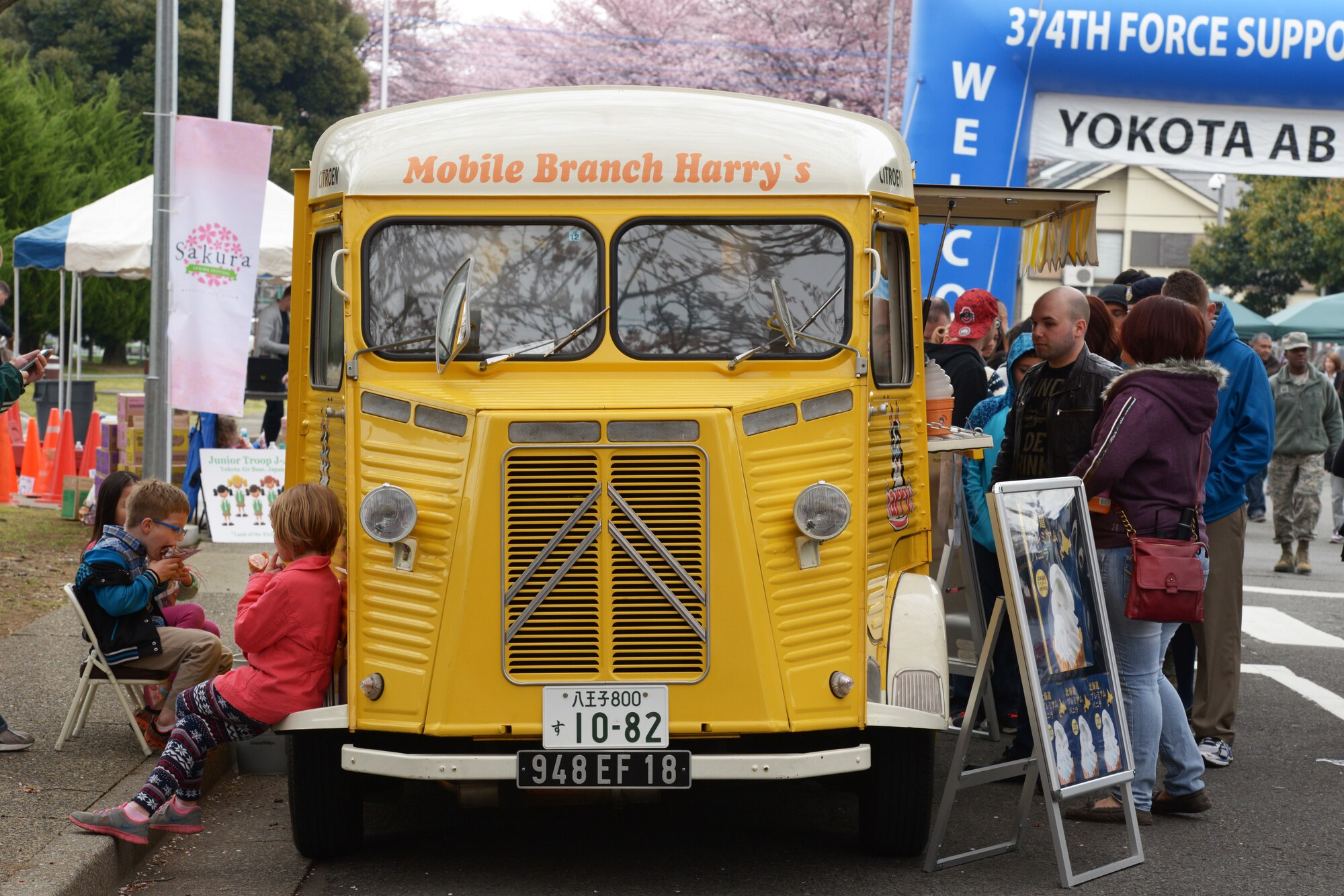 A food truck serves a line of customers during the Sakura Spring Festival at Yokota Air Base, Japan, April 2, 2016. The festival consisted of band performances, dancers, Taiko drummers and food booths, offering a chance for Japanese citizens to experience American culture within the base’s perimeter. Approximately 5,000 people attended the event to celebrate the coming of spring. (U.S. Air Force photo by Staff Sgt. Cody H. Ramirez/Released)