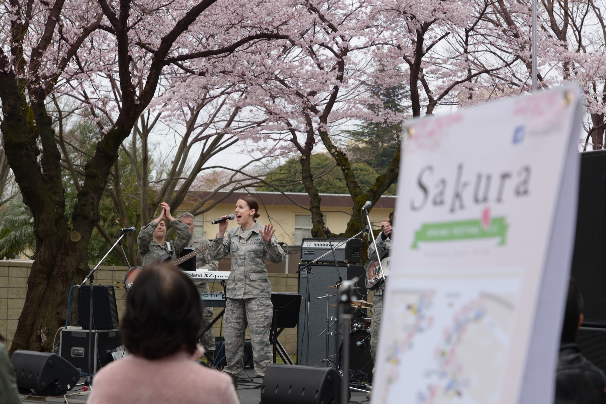 The Band of the Pacific-Asia performs during the Sakura Spring Festival at Yokota Air Base, Japan, April 2, 2016. The band performed a majority of American songs, introducing a U.S. culture experience to Japanese viewers, but they also played traditional Japanese songs, showing respect to their host-nation culture. (U.S. Air Force photo by Staff Sgt. Cody H. Ramirez/Released)