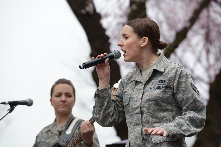 Senior Airmen Rebecca Allen (right) and Emily Wheaton (left), both members of the Band of the Pacific-Asia, perform during the Sakura Spring Festival at Yokota Air Base, Japan, April 2, 2016. The band performed a majority of American songs, introducing a U.S. culture experience to Japanese viewers, but they also played traditional Japanese songs, showing respect to their host-nation culture. (U.S. Air Force photo by Staff Sgt. Cody H. Ramirez/Released)