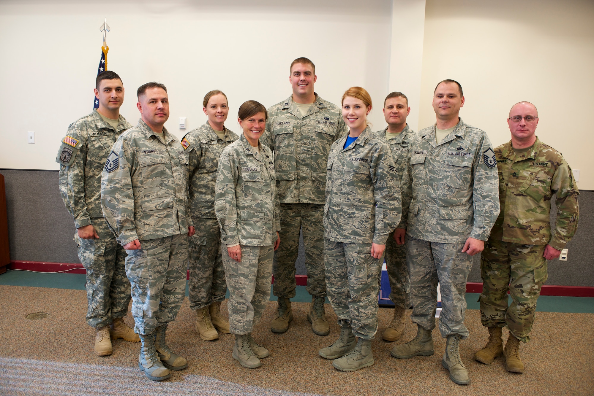 U.S. Air Force Capt. Benjamin N. Garland, Public Affairs Officer and offensive lineman for the Atlanta Falcons, assigned to the 140th Wing, receives a token of thanks from the Army National Guard at Buckley Air Force Base Feb. 21, 2016. A ceremony was held to honor the collaborative effort put forth by Garland and the Army National Guardsmen to ensure service members understand the importance of head injuries as they relate to the military and the National Football League. (U.S. Air National Guard photo by Senior Airman Bobbie Reynolds)
