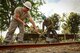 U.S. Air Force Staff Sgt. Kyle Gould, left, and Philippine Army Cpl. Gilbert Balobalo level dirt for a basketball court during Exercise Balikatan 2016 at Jaena Norte Elementary School in Capiz, Philippines, April 2, 2016. Gould is assigned to the 673rd Expeditionary Engineer Squadron and Balobalo is assigned to 552 Engineer Construction Battalion. (U.S. Marine Corps photo by Cpl. Hilda M. Becerra/Released)