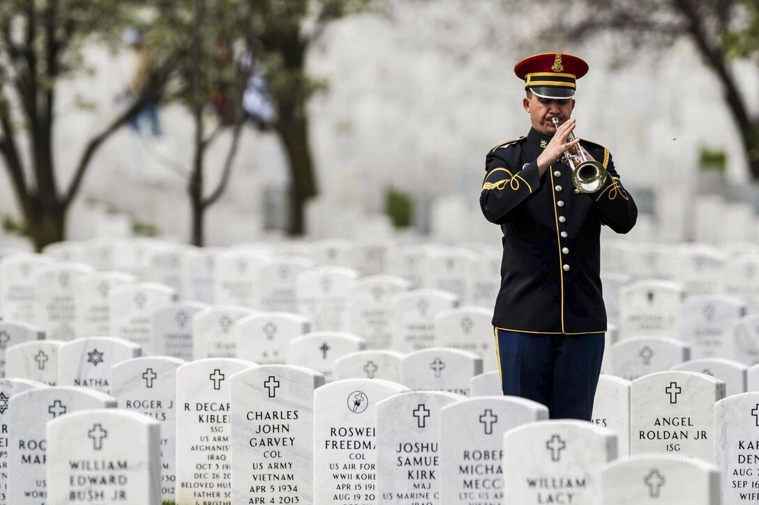 A soldier performs taps during a full-honors memorial service for Army Sgt. Wilson Meckley in Section 60 of Arlington National Cemetery in Arlington, Va., April 4, 2016. Meckley, who was assigned to the 7th Infantry Division's Company A, 1st Battalion, 32nd Infantry Regiment during the Korean War, was reported missing Dec. 2, 1950. On March 28, 2016, the Defense Department announced his body had been recovered. Army photo by Sgt. Cody W. Torkelson