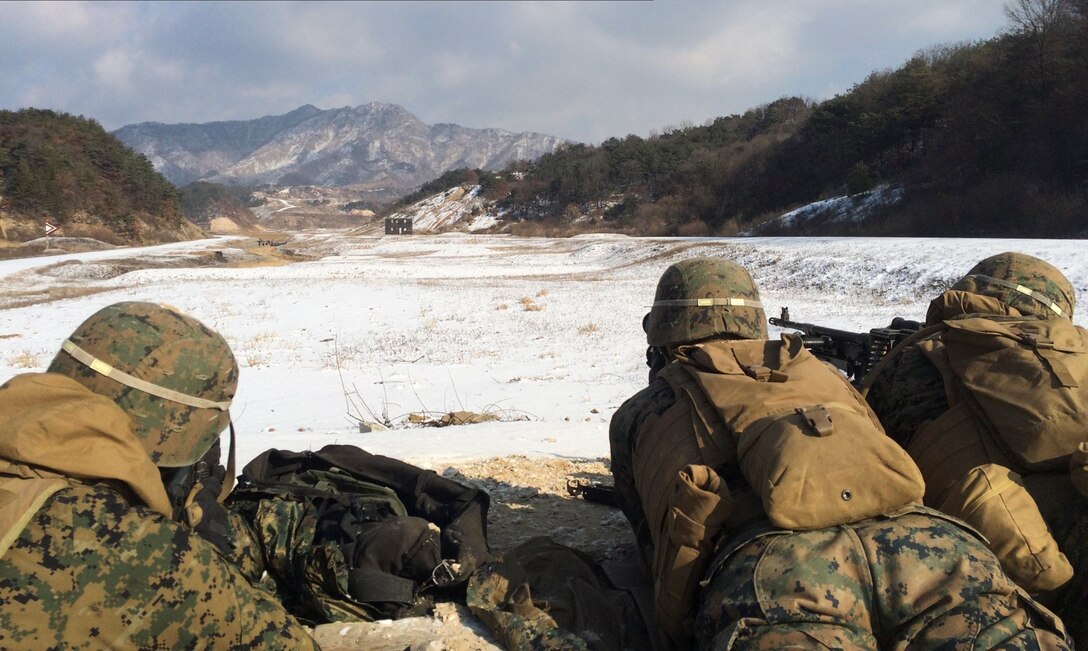 Marines from 3rd Platoon, Combat Engineer Company, Combat Assault Battalion, observe the impact of 7.62 mm rounds Jan. 28 at Rodriguez Live Fire Complex, Republic of Korea. The Marines are from Combat Assault Battalion, 3rd Marine Division, III Marine Expeditionary Force, forward deployed in the Pacific. 