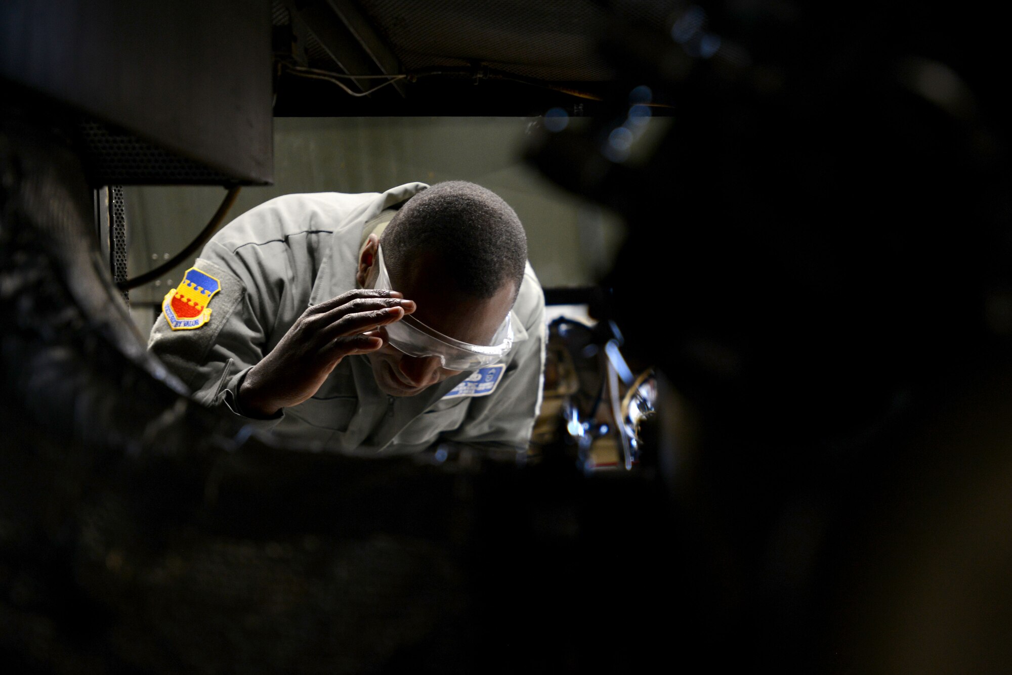 U.S. Air Force Chief Master Sgt. Christopher McKinney, 20th Fighter Wing command chief, peers into an A/M32A-60 generator at the 20th Equipment Maintenance Squadron aerospace ground equipment shop at Shaw Air Force Base, S.C., March 29, 2016. The generator is used to troubleshoot the engine and electrical system of the F-16CM Fighting Falcon, saving the cost of the fuel that would be used to run the jet during maintenance. (U.S. Air Force photo by Airman 1st Class Kelsey Tucker)