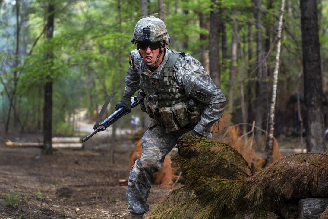 Army Staff Sgt. Brian Dolan advances to the next station while taking simulated direct fire during Expert Infantryman Badge qualification at Fort Jackson, S.C., March 31, 2016. Dolan is assigned to Company B, Special Troops Battalion, 171st Infantry Brigade. Army photo by Sgt. 1st Class Brian Hamilton
